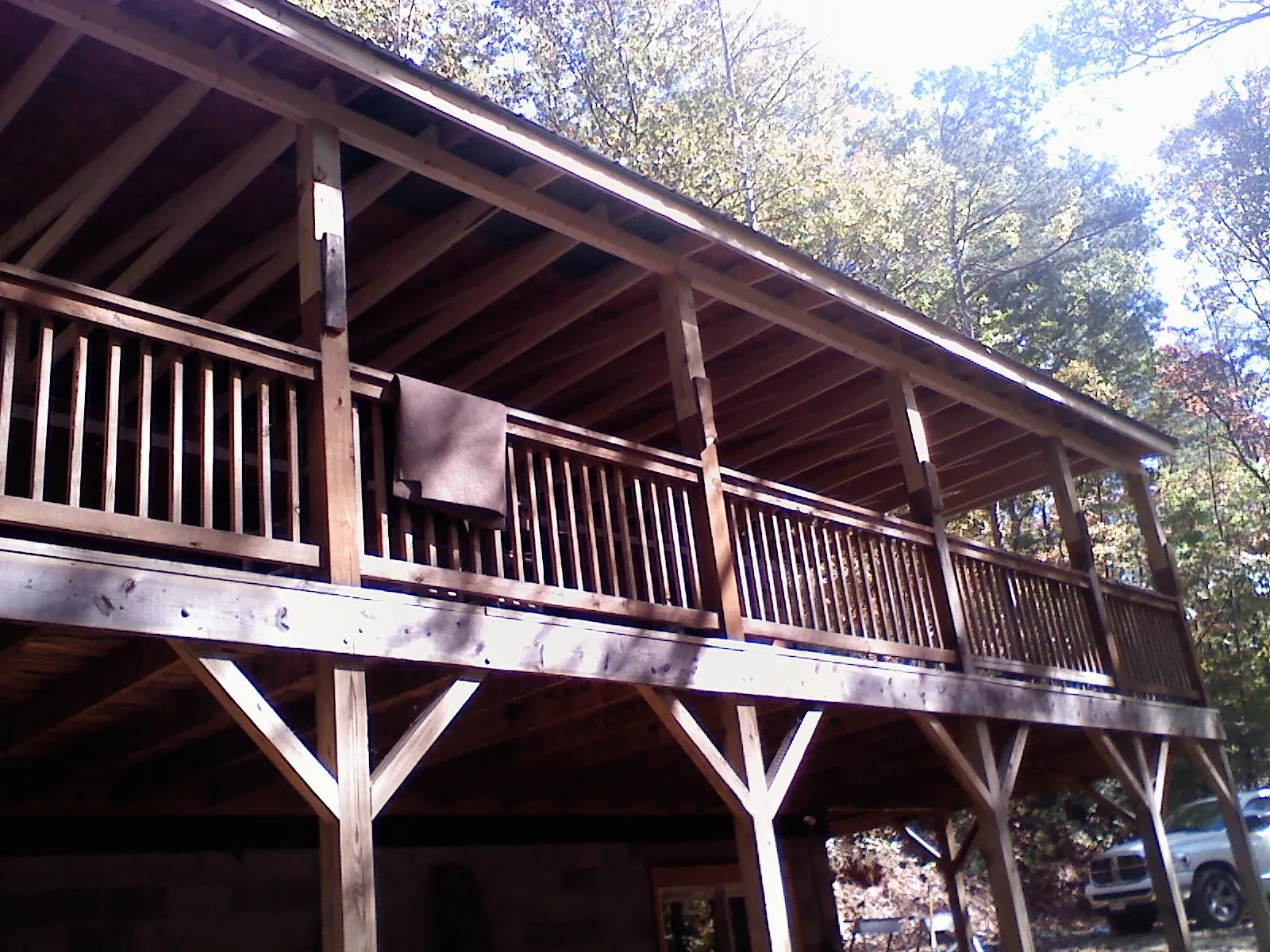 Timber framing under a new elevated porch and deck — Roof Leak Repair in Harlem by Roofing Brothers